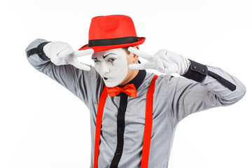 Male, actor, pantomime, posing at the camera. Isolated on white background.