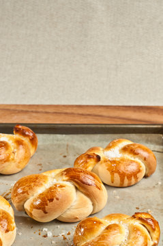 Baked, organic knotted rolls, biscuits on a baking sheet