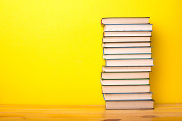 Books on a yellow background
