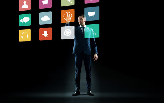 businessman in suit touching virtual menu icons