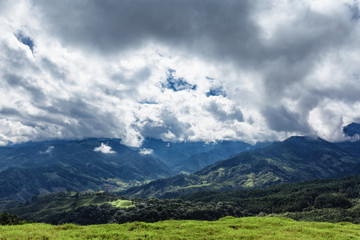 Fototapeta na wymiar Valleys and dramatic clouds outside of Salento, Colombia.