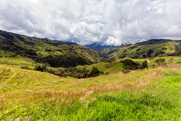 Dramatic clouds over pastures in a valley outside of Salento, Colombia.