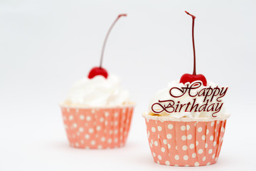 Happy birtthday word and cup cake with red cherry