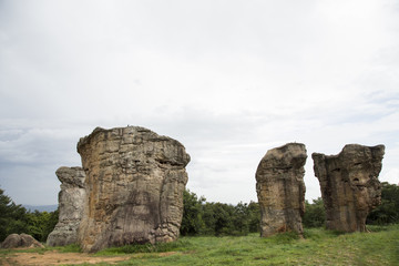The old stone shape is strange on the mountain, white stone and grass fields beautiful...