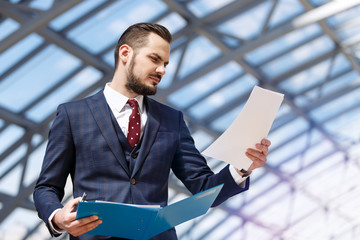 Businessman holding binder