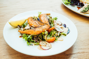 Grilled salmon fillet meat with vegetable salad