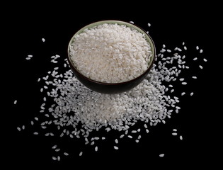 White rice in a bowl isolated on black background