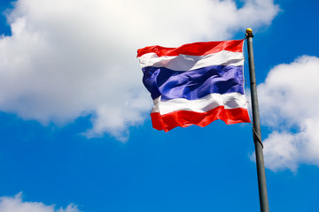 Image of waving Thai flag of Thailand with blue sky background
