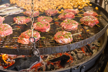 Delicious roasted or barbecued marinated steaks and mushrooms on hot grill