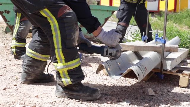 Firefighter practicing with a disc cutter