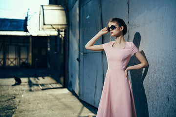 Woman in glasses, woman on old wall background