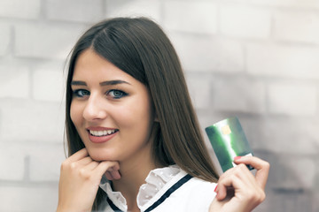 She is happiest when in the hand has a credit card, then herself buys whatever he wants