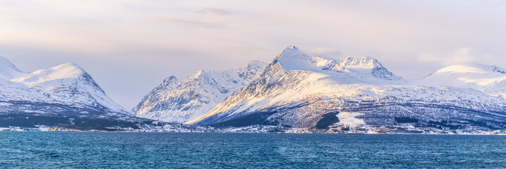 Snowy mountain peaks during the sunset in Norway