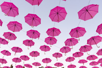 Fototapeta na wymiar Umbrellas floating in the sky