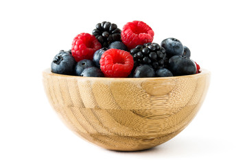 Healthy berries in wooden bowl isolated on white background
