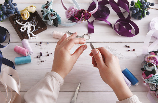 Master making handmade jewelry, woman pov