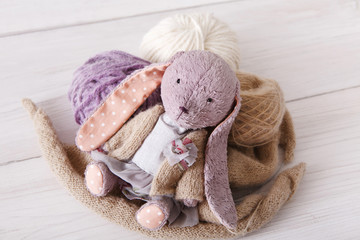 Cute handmade rabbit with wool close up