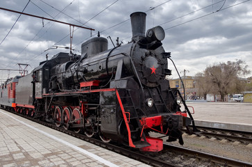 Vintage steam train on parade in honor of Victory day