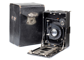 Ancient camera and case on a white background