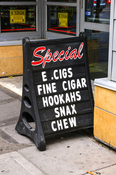 E. Cigs, Fine Cigars, Hookahs, Snax and chew tobacco sign in Minneapolis, MN, USA
