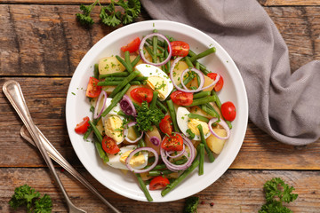 vegetable salad with potato,egg,bean and tomato