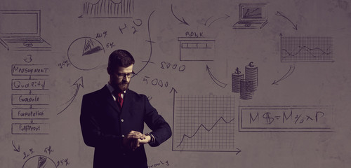 Businessman standing over schematic background. Business and office, concept.