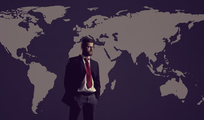 Businessman standing over world map background. Business, globalization, concept.