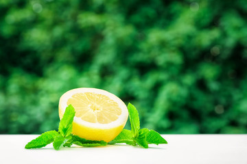 Lemons and limes on bright background