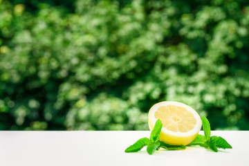 Lemons and limes on bright background