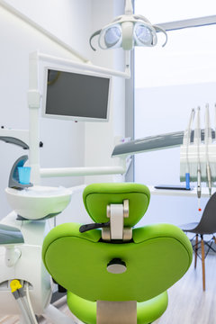Dental room with green chair