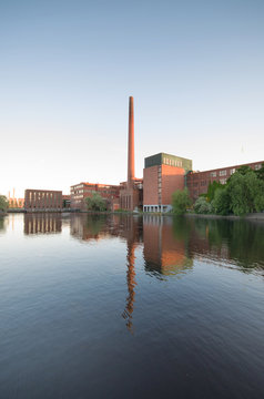Tampere city old industrial buildings in Tammerkoski river, Finland.