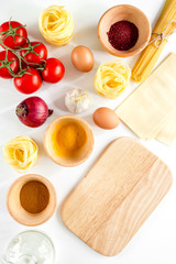 Preparing for cooking italian pasta white background top view mock up