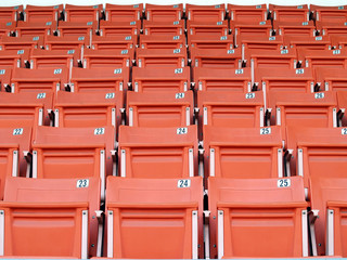 Naklejka premium front of plastic stadium grandstand seats with seat label number in sport arena