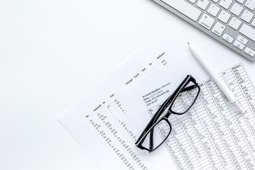 business accounter work with taxes and keyboard on white office desk top view mock up