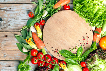 Fresh farm vegetables and herbs on rustic background. © yakky