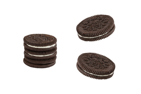 Cookies and cream chocolate cookies in stack and single pieces isolated on white background (clipping path included)