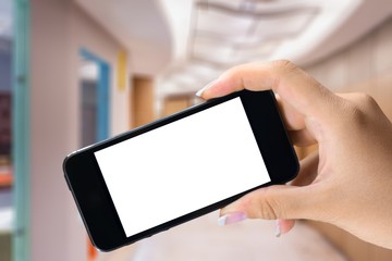 Hand holds phone.