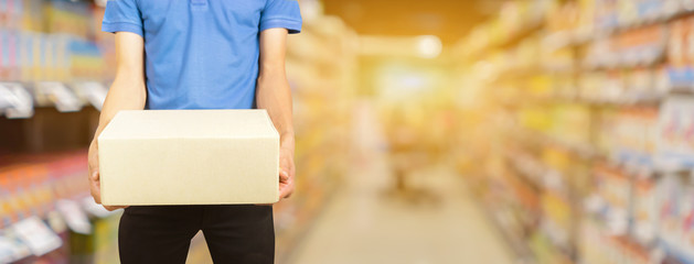 shopping online  and order concept,male postal delivery courier   package to home ,Products and services fashion clothing.for banner your can ad text for advertising