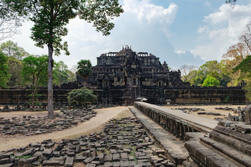 Fototapeta na wymiar Baphuon Temple in Angkor Complex, Siem Reap, Cambodia. It is three-tiered temple mountain and dedicated to the Hindu God Shiva. Ancient Khmer architecture and famous Cambodian landmark, World Heritage