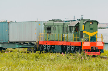Obraz premium Freight train wagons with containers sorting station.