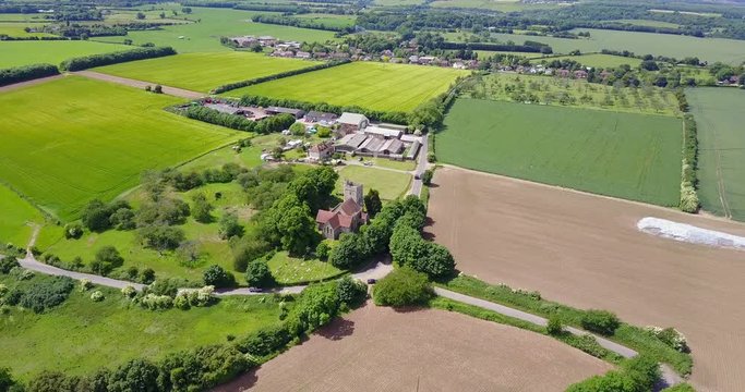 Aerial view of and old English St Mary Magdalene Church, Stockbury Parish, near Sittingbourne with a view of a farm in the background
