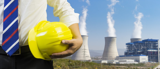engineering management construction helmet,engineer or worker hold in hand yellow helmet for...