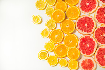 Gradient color citrus slices on white background