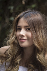Naklejka premium Portrait of a young woman with a beautiful smile