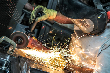 Grinding steel as sparks fly