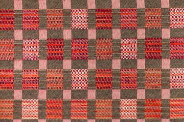 Dark brown and red background with geometric patterns