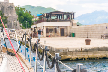 Mooring is fixed on the rails while the yacht is moving. Montenegro, the Adriatic Sea.