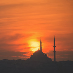 Mosque silhouette on The sunset and two minarets