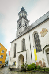A low angle view of St Georges Church belfry in Freising, Germany.