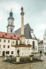 The Mary's Column at the town square with town hall and Saint Georges Church in Freising, Germany.